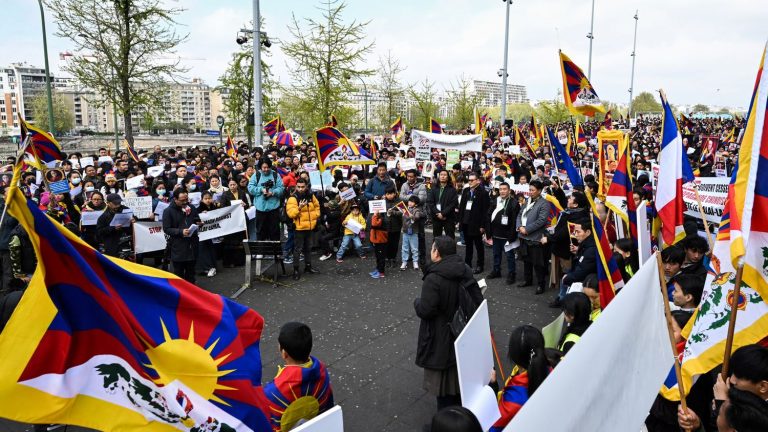 Hundreds of Tibetans demonstrate in Paris in support of the Dalai Lama after a controversial video