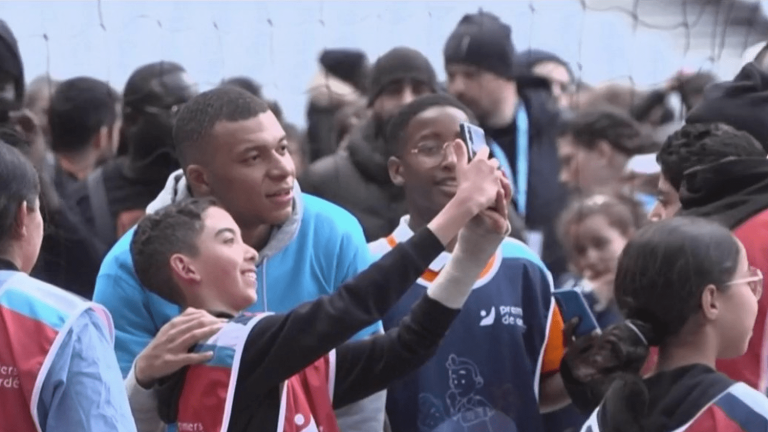 Kylian Mbappé meets and plays with children at the Stade de France