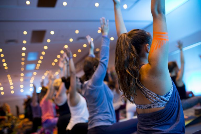 Large yoga gatherings are redefining themselves