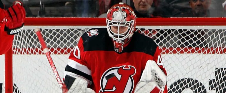 Who is Akira Schmid, the Devils savior in goal?