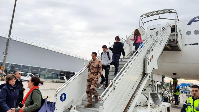 a first plane with 245 French and foreign nationals lands in Paris