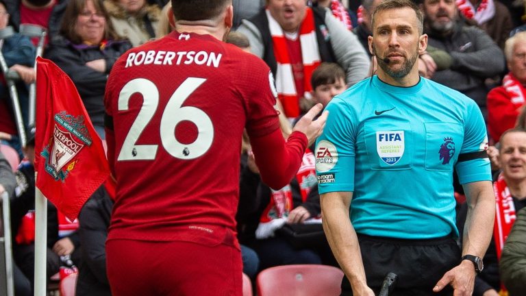 linesman suspended for suspected elbowing of Liverpool player