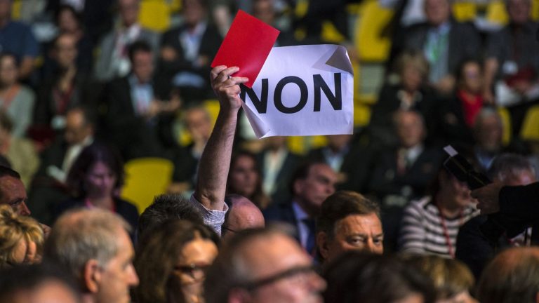 red cards and whistles distributed by the unions to spectators