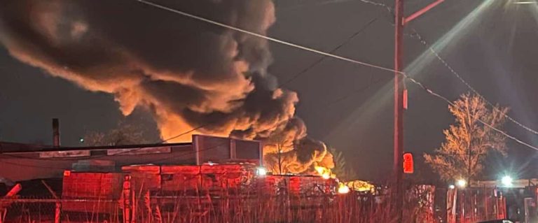 A fire ravages the yard of a car recycler