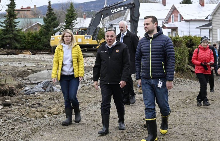 François Legault passing through a devastated Charlevoix