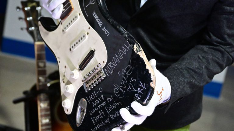 Kurt Cobain guitar smashed on stage, sold for $600,000