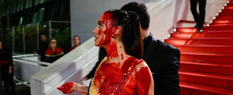 Model covered in blood at Cannes Film Festival