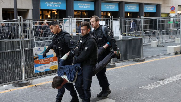 scuffles between climate activists and police ahead of oil giant’s general meeting in Paris