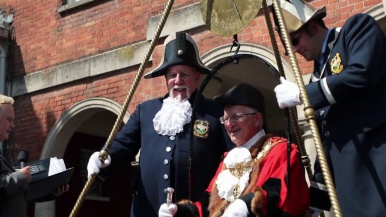 the mayor of this small town passes on the scale every year in front of the crowd