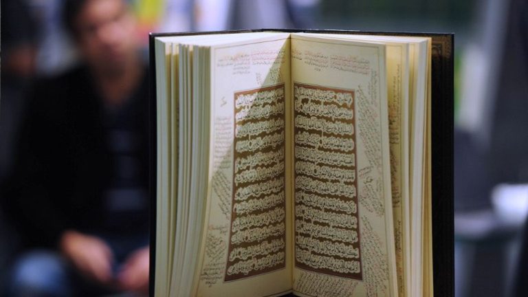 two men were hanged for burning a copy of the Quran