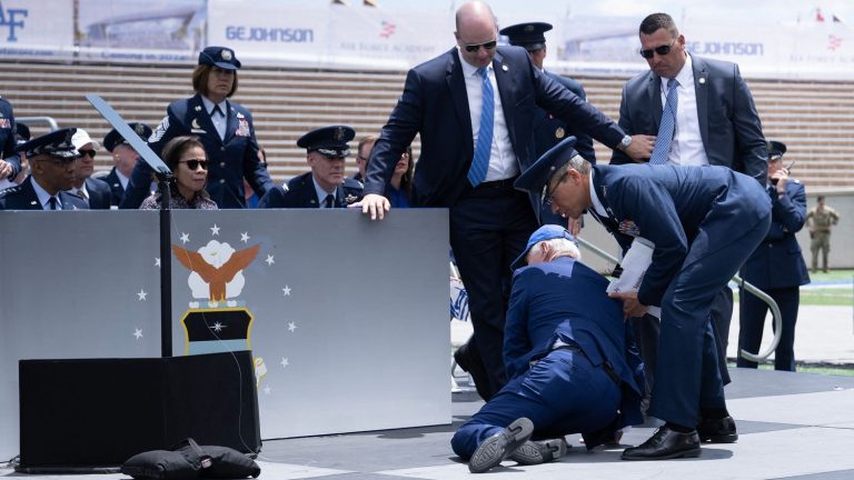 Joe Biden falls on stage during a military ceremony