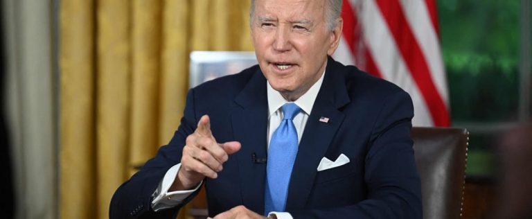 Biden enacts law ruling out US default