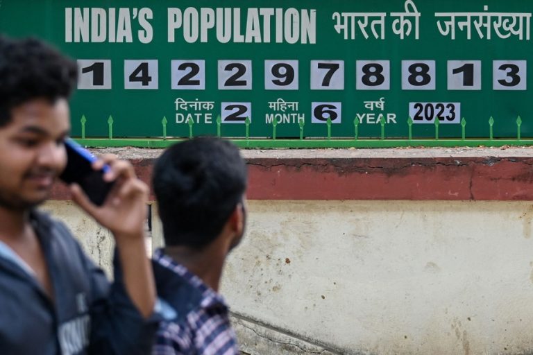 India |  A clock keeps count of the most populous country in the world