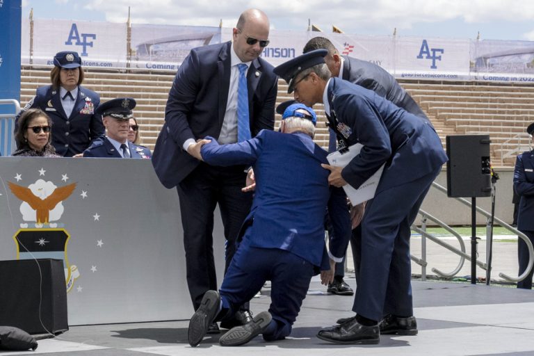 Joe Biden falls on stage during a military ceremony