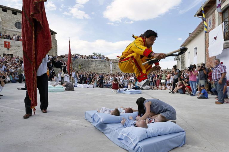 Traditional Spanish Festival |  A “devil” jumps over babies