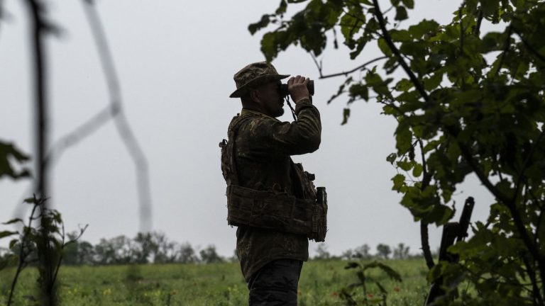 Ukrainian forces try to find the breach amid Russian minefields