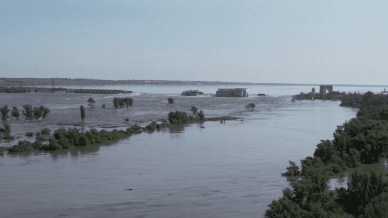 a dam destroyed, thousands of civilians threatened