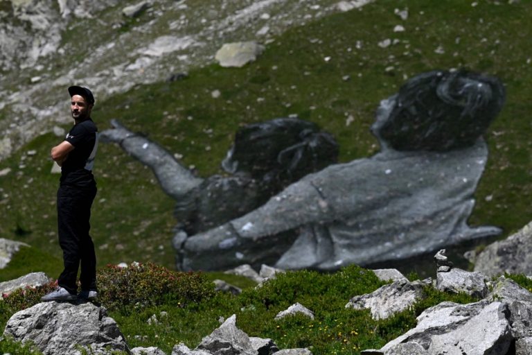 An artist unveils a giant fresco at the foot of Mont Blanc