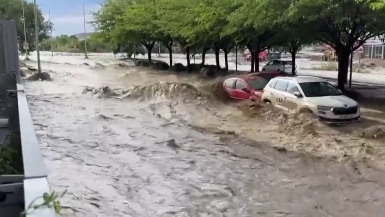 torrents of rain flood the streets of Zaragoza