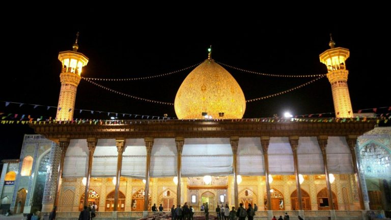 two men hanged in public for attacking a shrine