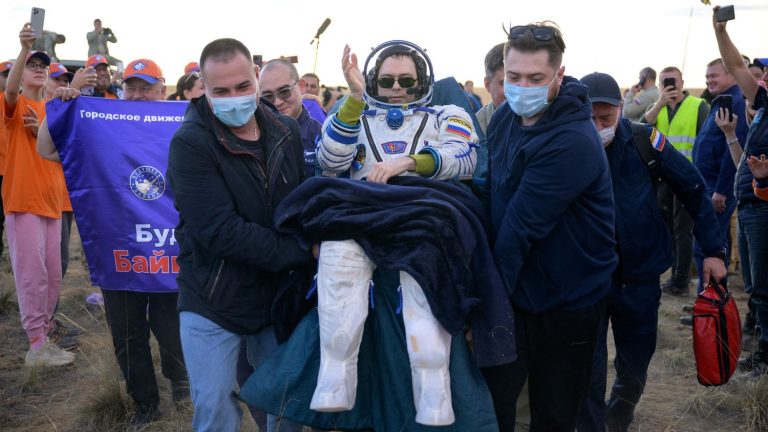 An American astronaut and two Russian cosmonauts return to Earth after a stay on the ISS