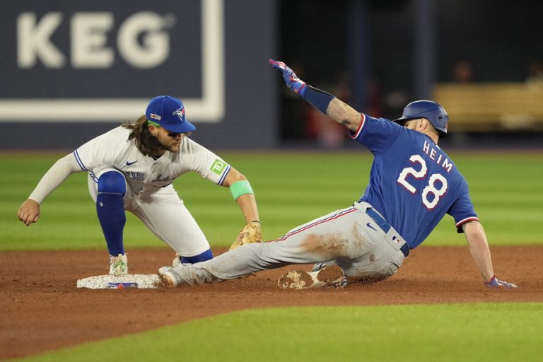 Heim hits grand slam in Rangers win in Toronto