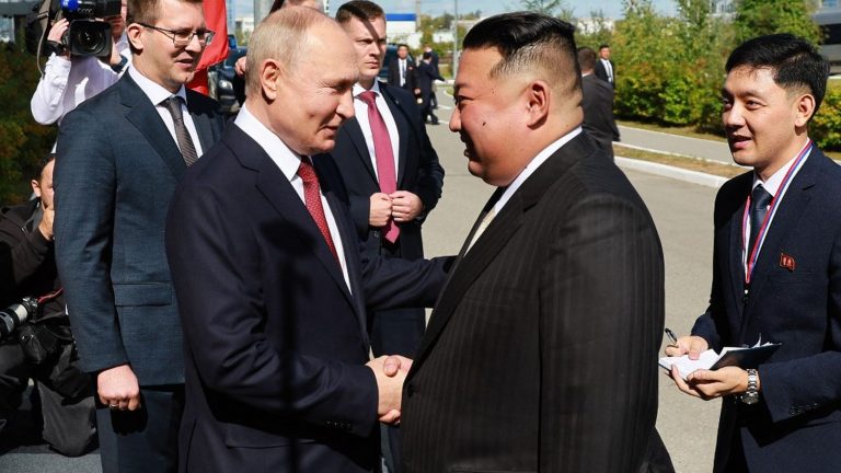 Vladimir Putin and Kim Jong-un shake hands at the Vostochny cosmodrome in eastern Russia