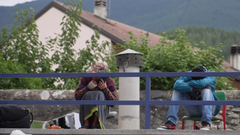 in the mountains with migrants attempting the difficult passage between Italy and France