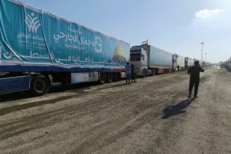 At the gates of Gaza, humanitarian aid piles up in Egypt