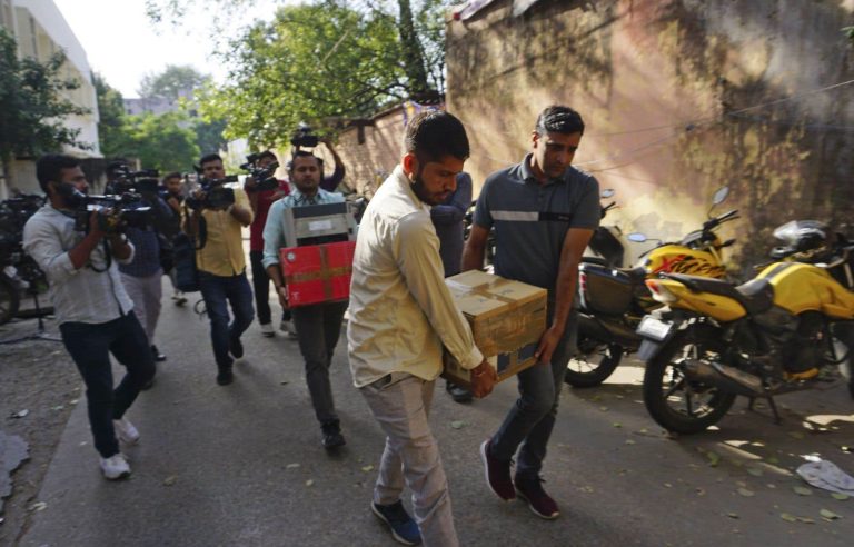 In India, police search the homes of journalists and activists