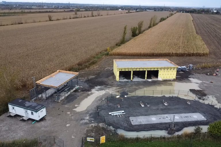 Laval |  A gas station on cultivated land