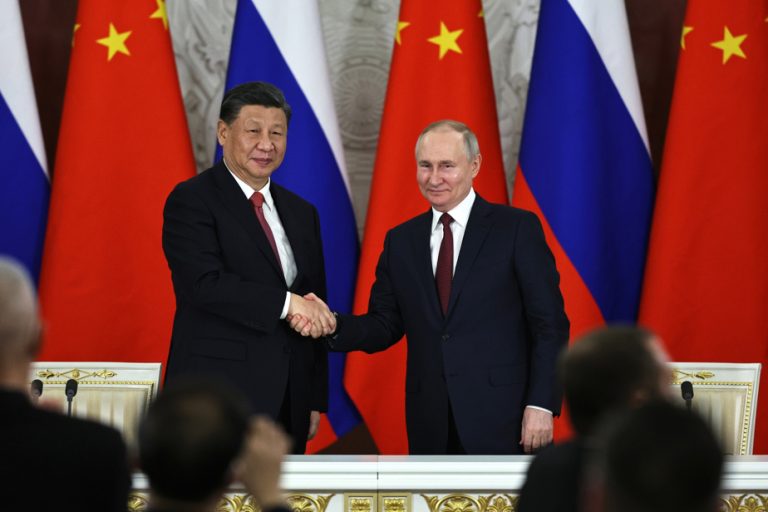 Vladimir Putin arrives in China, where he will meet Xi Jinping