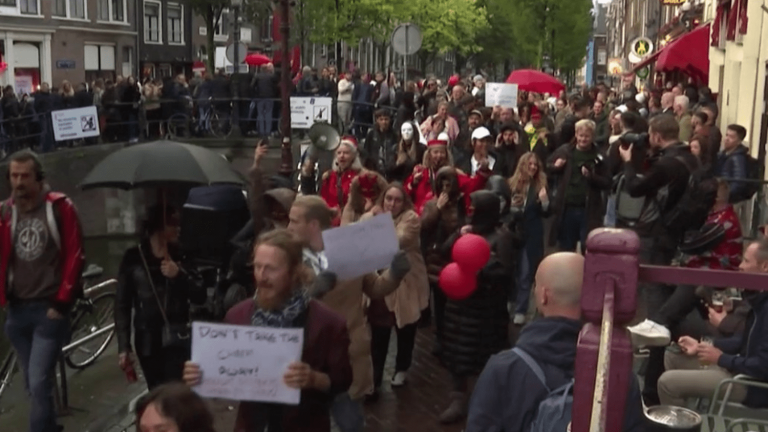 in Amsterdam, demonstrators march against the movement of the Red Light District to the suburbs