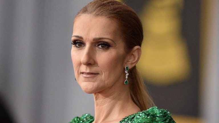 Celine Dion, impeccable lookalike of Morticia Addams alongside her man