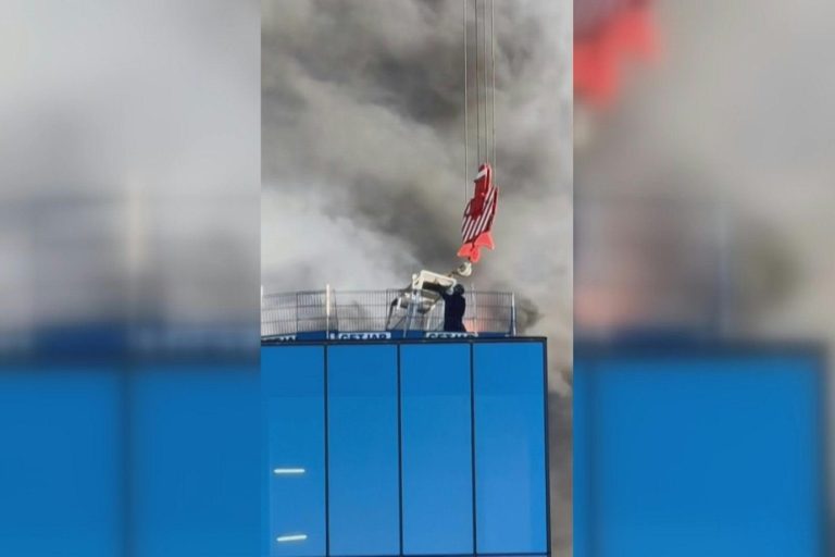 Man saved from fire by crane in England