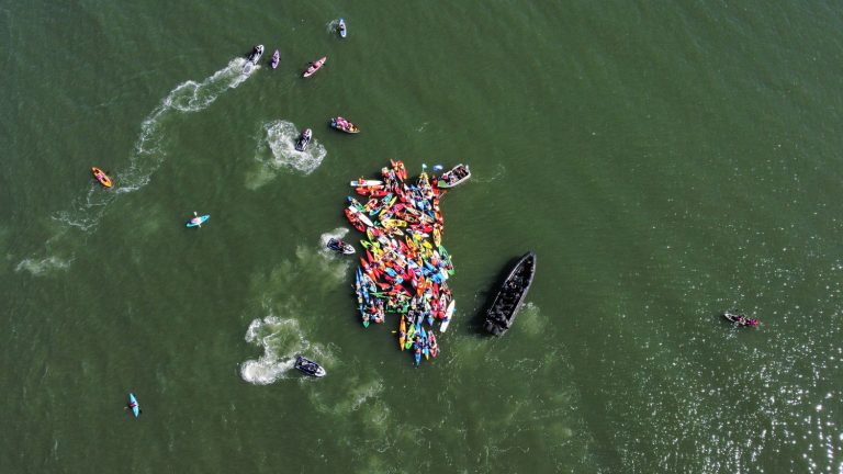 nearly 110 climate activists arrested for blocking a port with kayaks