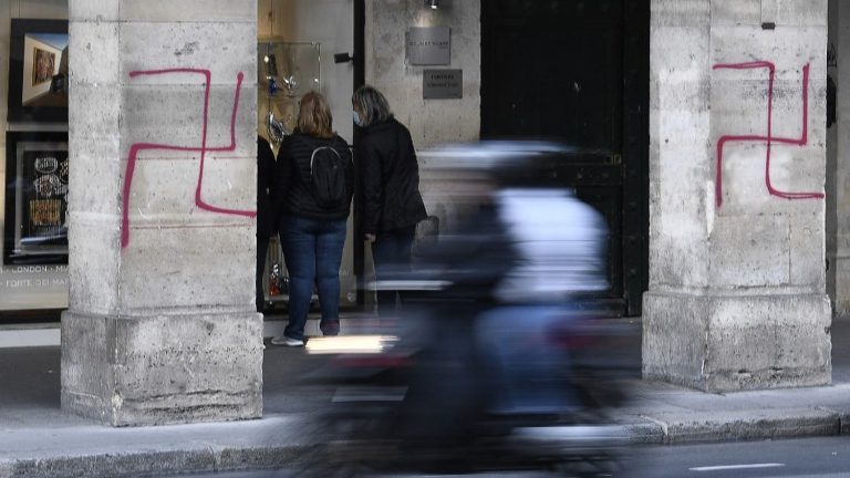 thirteen people, including seven on ultra-right S files, were arrested after swastika tags in Paris