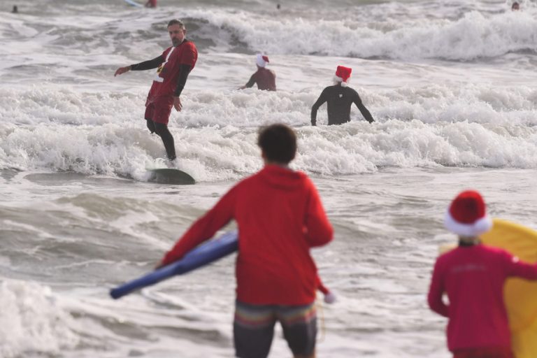 Florida |  Santas go surfing at Cocoa Beach