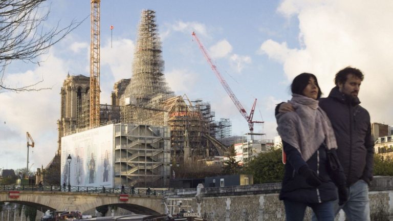 follow the installation of the cross on the new spire of the cathedral