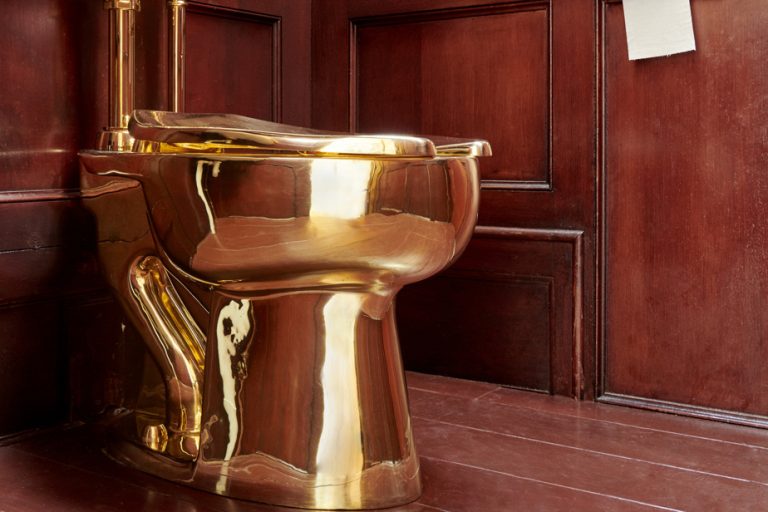 Three accused of stealing golden toilet plead not guilty