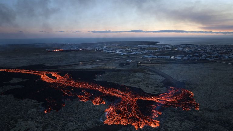 how hastily erected barriers helped contain the lava flow and save the village of Grindavik