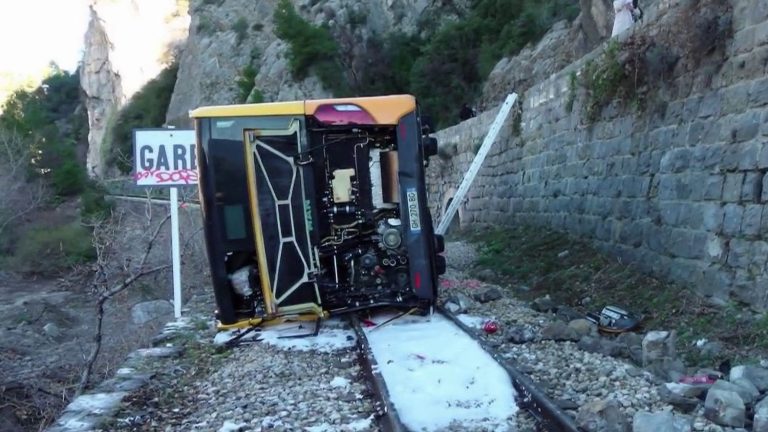 three injured after school bus crashes onto railway tracks