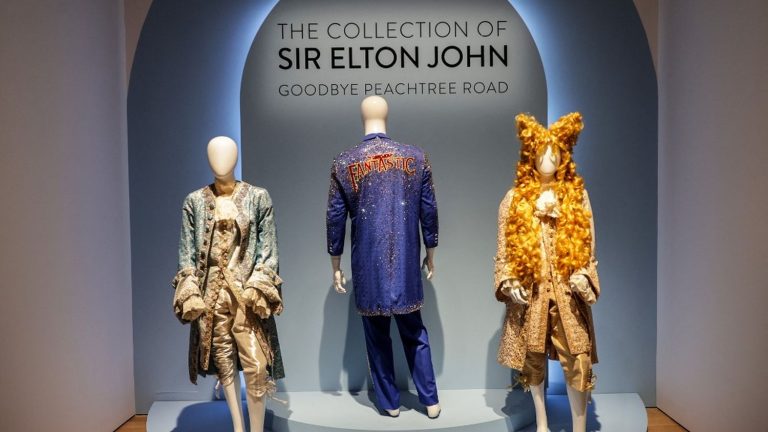 In New York, an auction of items belonging to Elton John brings in $8 million