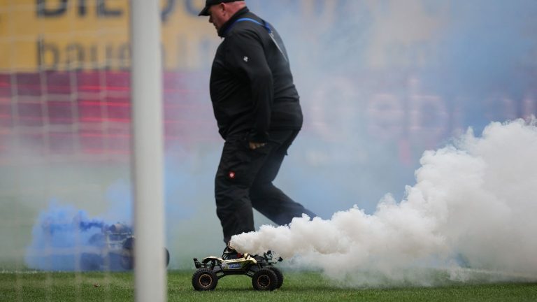 in Germany, supporters protest by sending remote-controlled cars onto the lawns