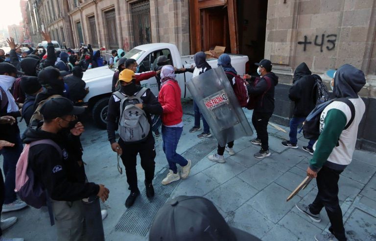 In Mexico, demonstrators break down the door of the presidential palace