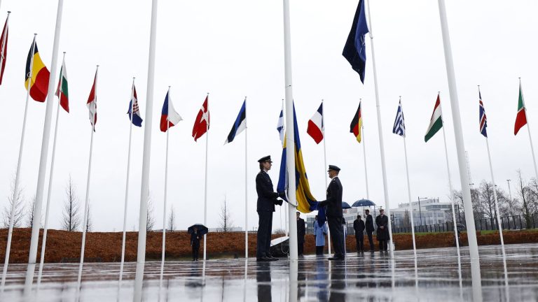 The flag of Sweden, now a member of NATO, was raised at the headquarters of the military alliance