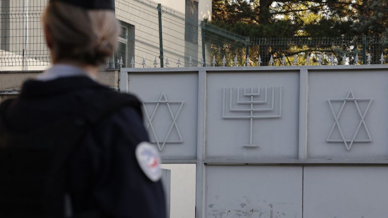 an investigation opened after the attack on a man leaving a synagogue