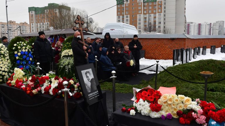 the crowd chants “No to war!”  near the cemetery where Alexei Navalny is buried