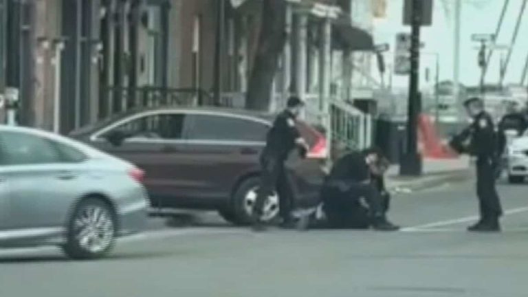 A police officer opens fire on a car thief who rushed towards him