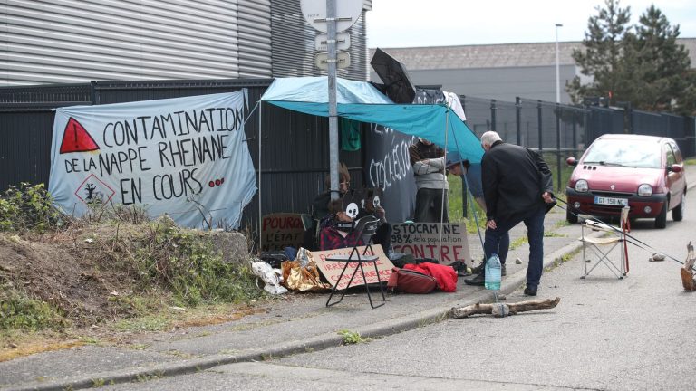 Extinction Rebellion activists, attached to the gates of the Stocamine toxic waste storage site, evacuated by the police